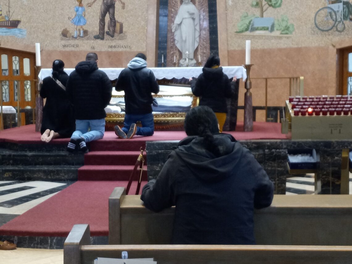 people kneeling before an altar
